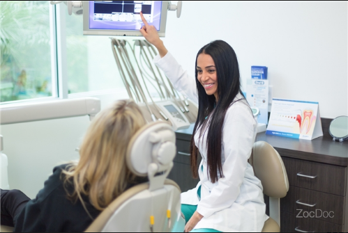 Dr. Pegah Pourrahimi in consultation with a patient