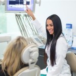 Dr. Pourrahimi in the office with a patient
